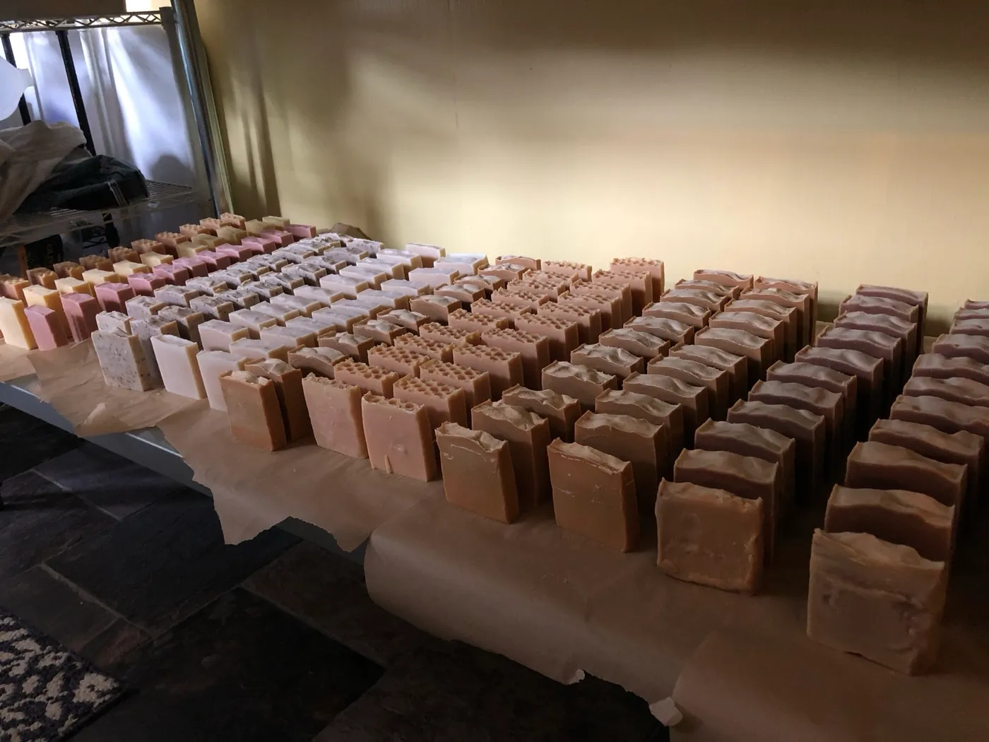 Rows of cut bars laid out on paper to cure